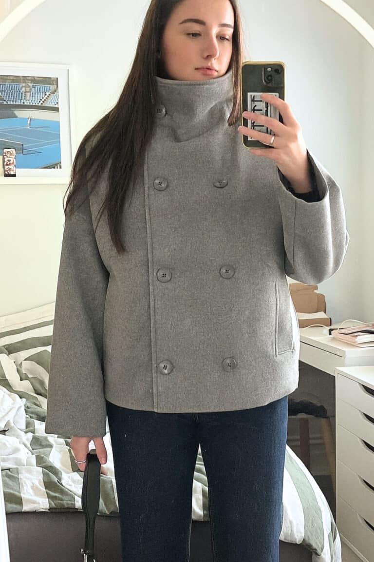 Woman wearing a stylish high-neck coat