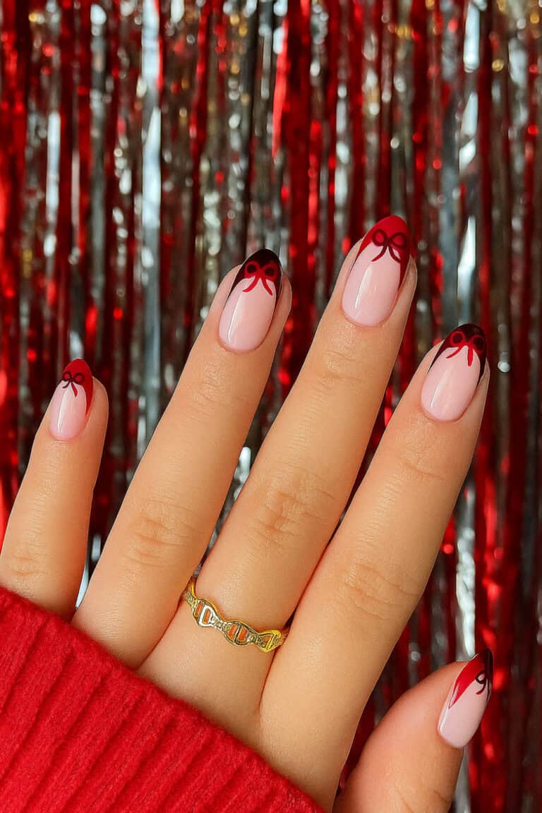 Dark red French tips with delicate coquette bows