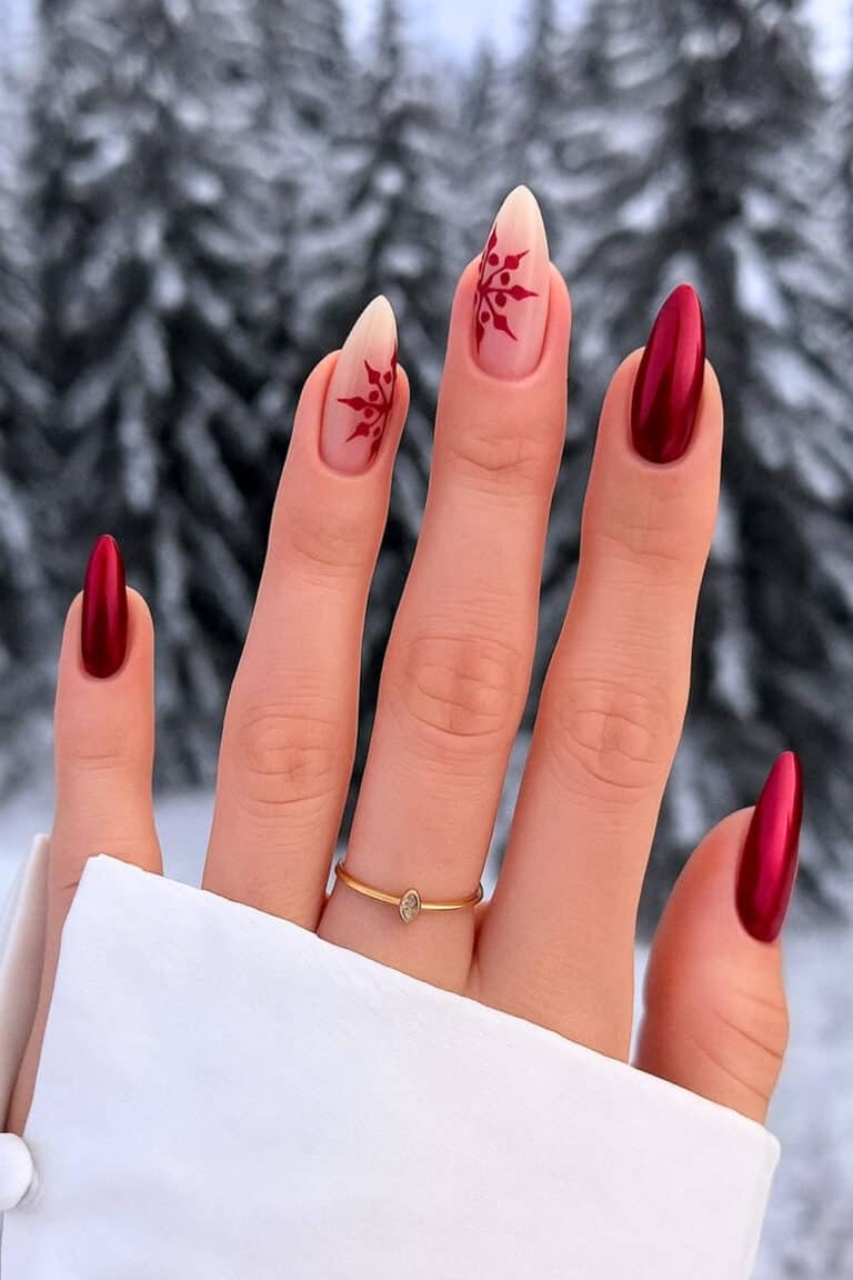 Dark red nails with delicate white snowflakes