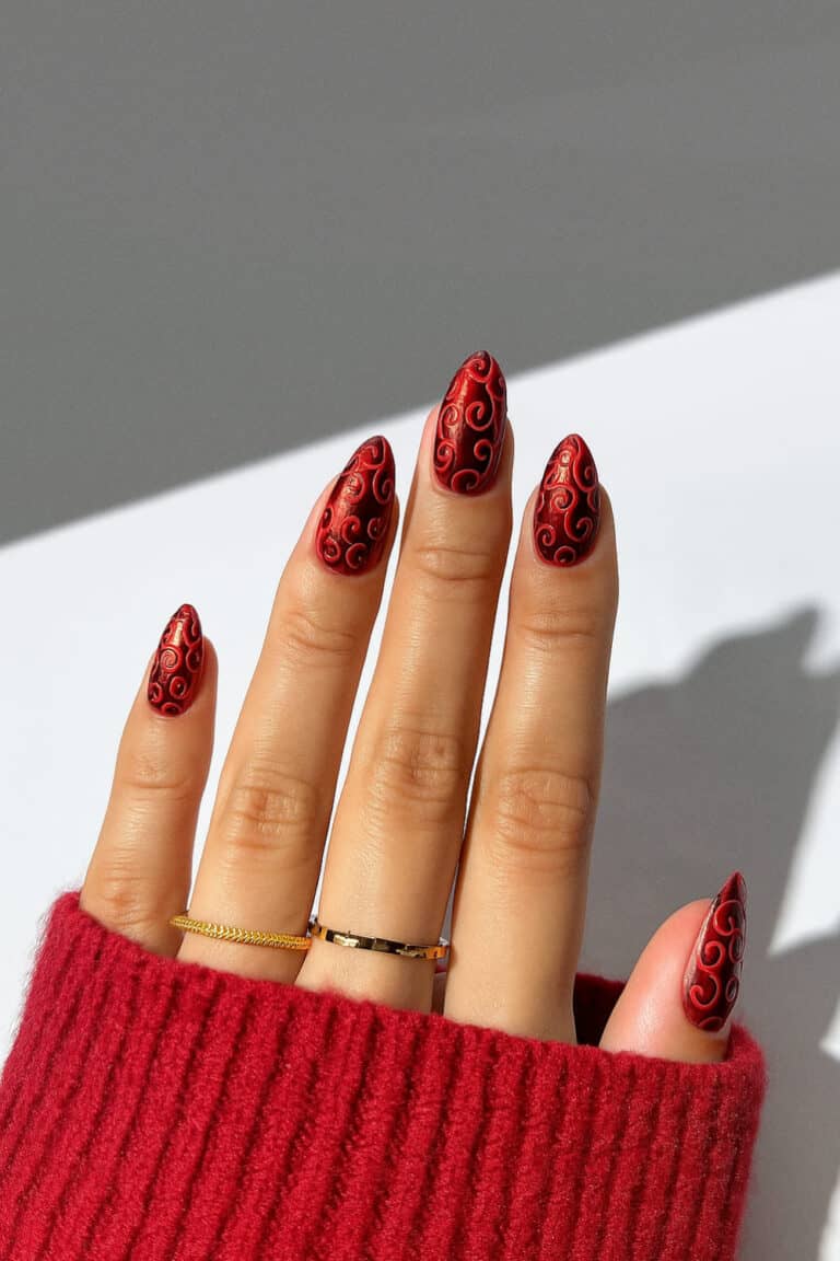 Deep red matte finish with glossy raised swirl detailing