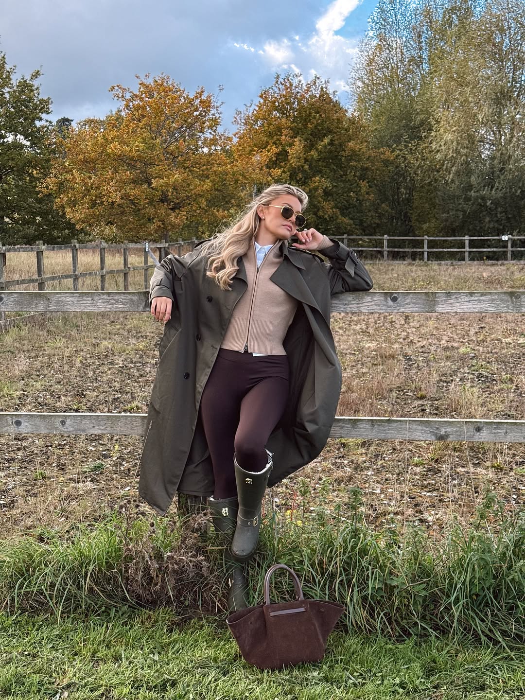 Waxed coat, knit zip-up, button-down shirt, and riding leggings