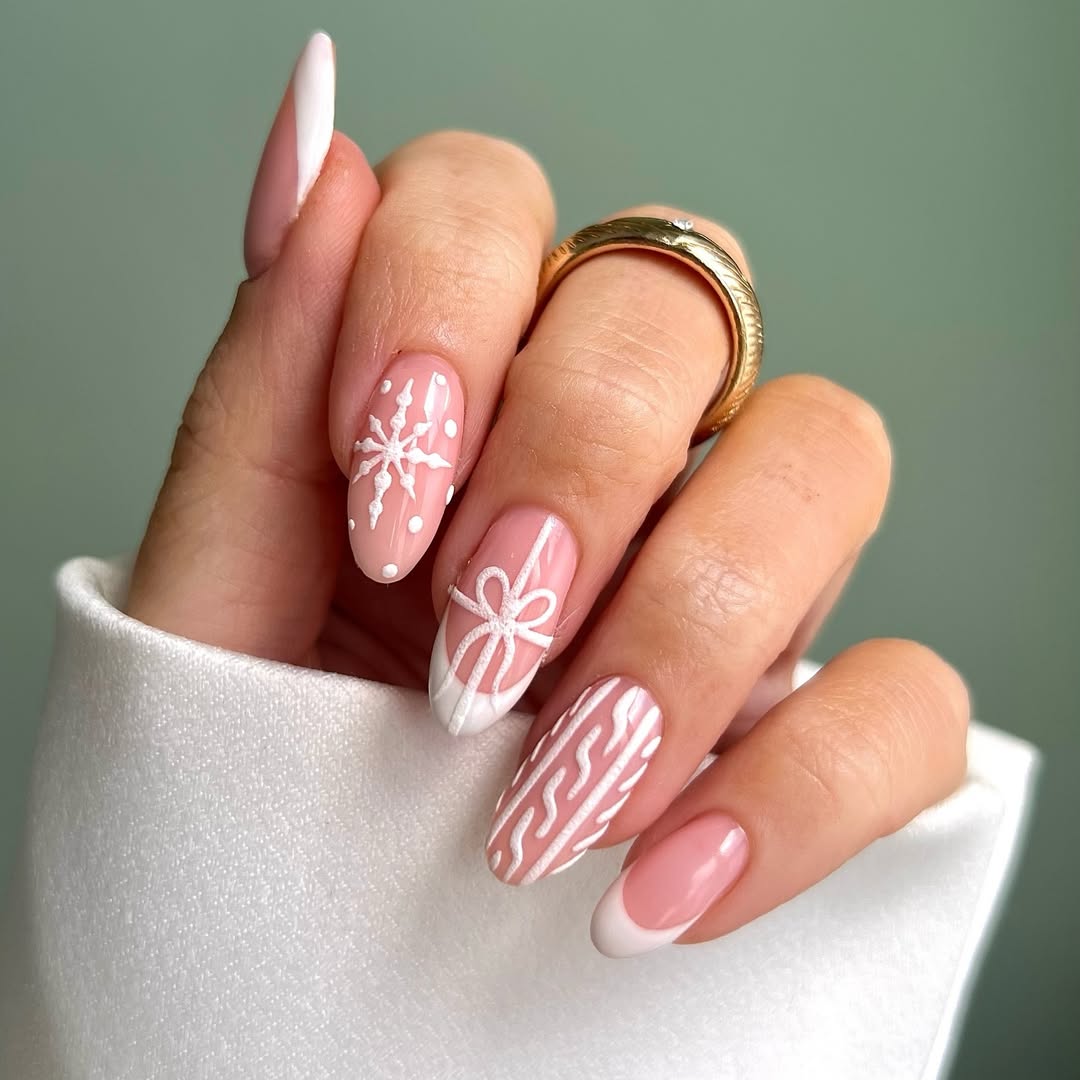 White French tips with sweater texture and snowflake accents