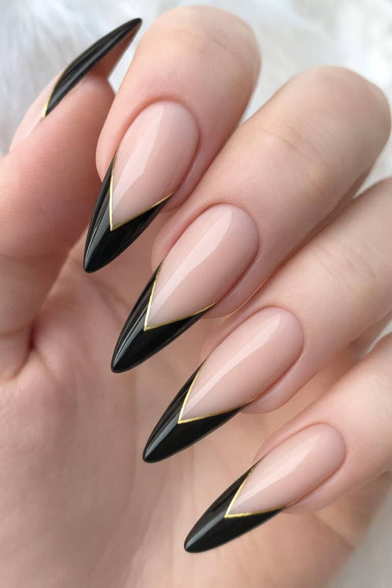 Black and gold French tip New Year's Eve nails