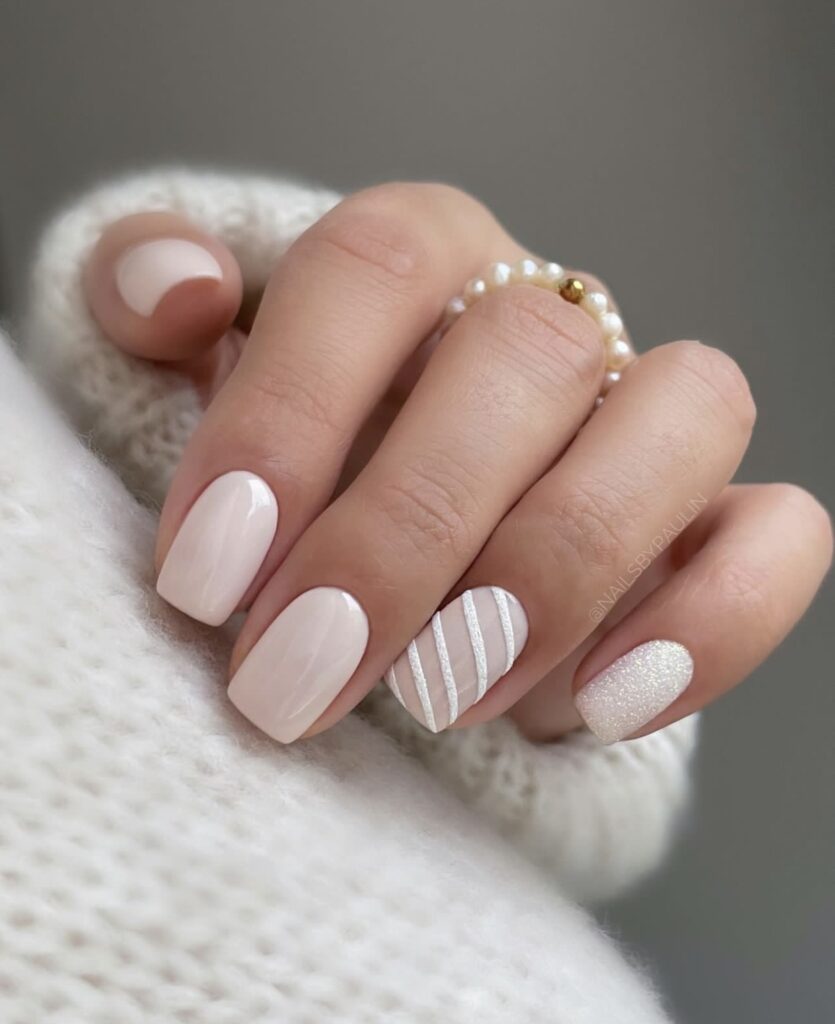 Short winter nails in a chic cream shade, ideal for the clean girl aesthetic.