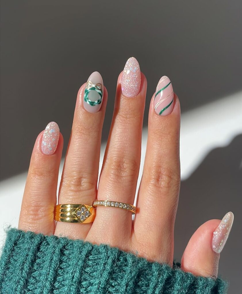 Iridescent glitter nails with mint green ribbon design and pink swirls.