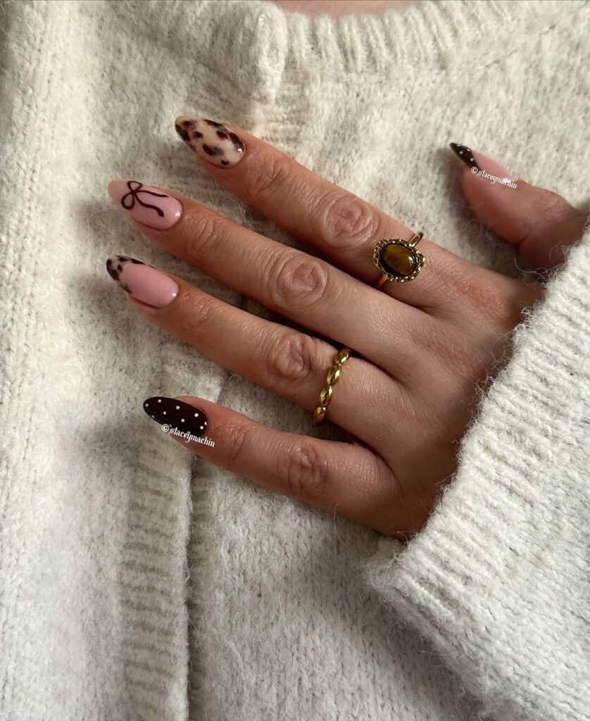 Leopard print tips with a small bow and chocolate brown polka dots.
