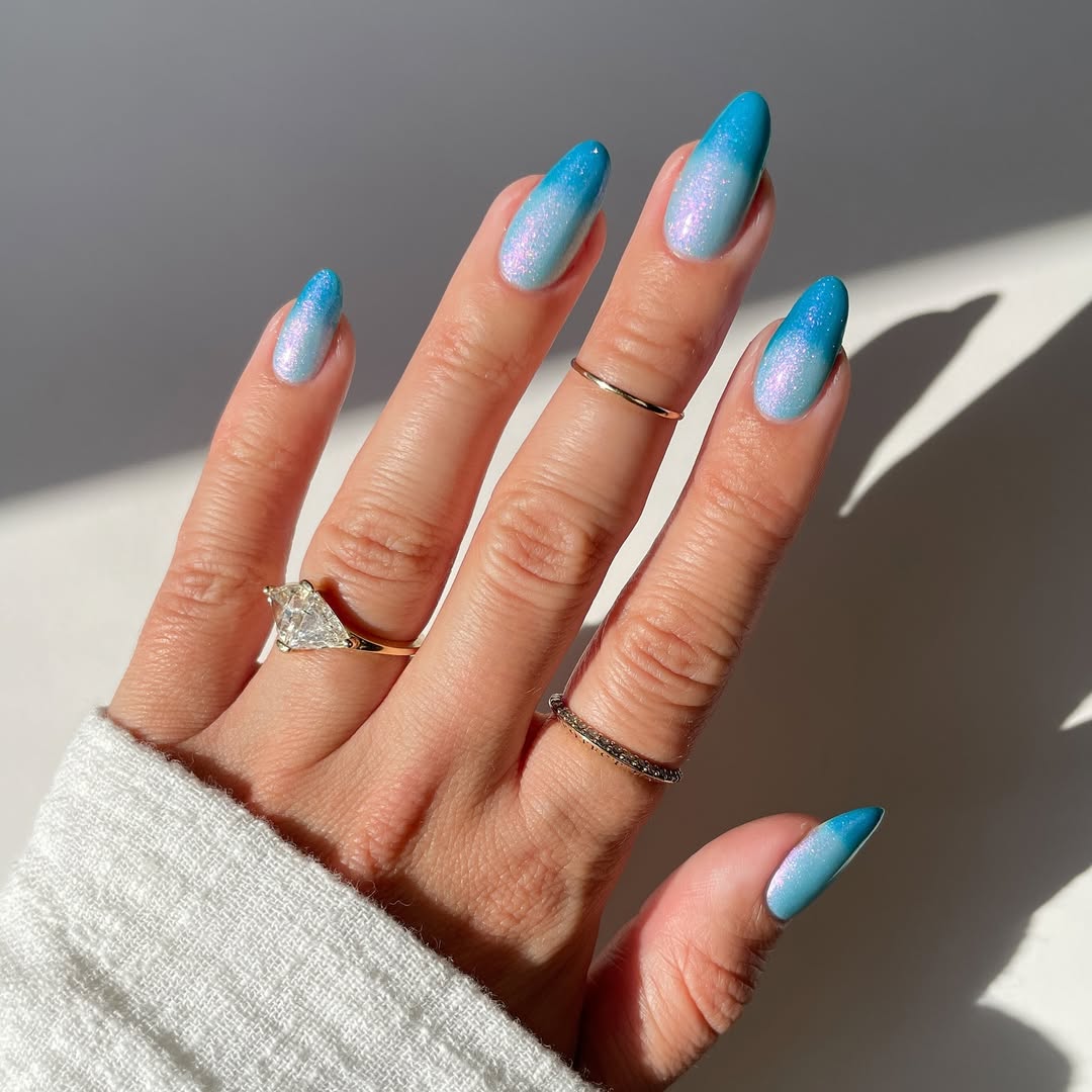 Blue and pink shimmer ombré French tips with a frosted effect