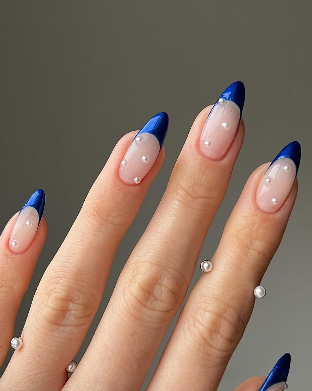 Royal blue French tips with scattered pearls