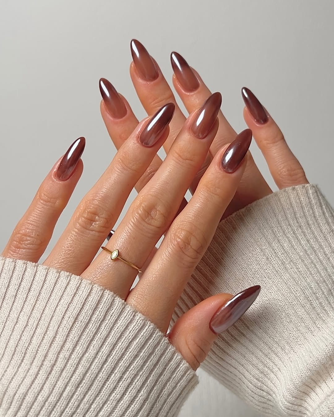 Soft cocoa chrome nails with a gradient effect