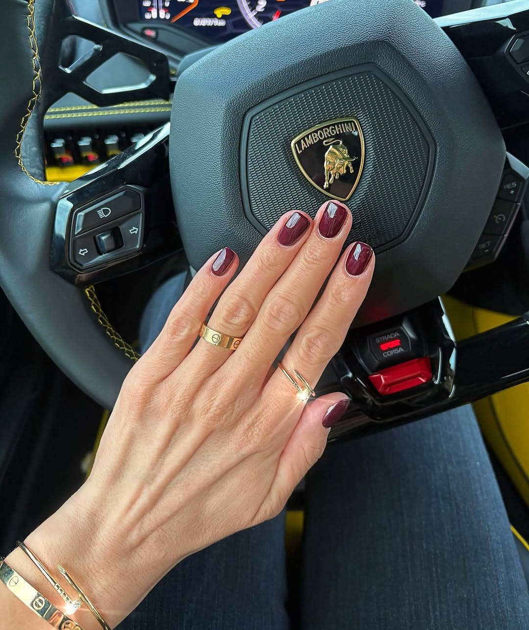 Short burgundy nails with a glossy finish