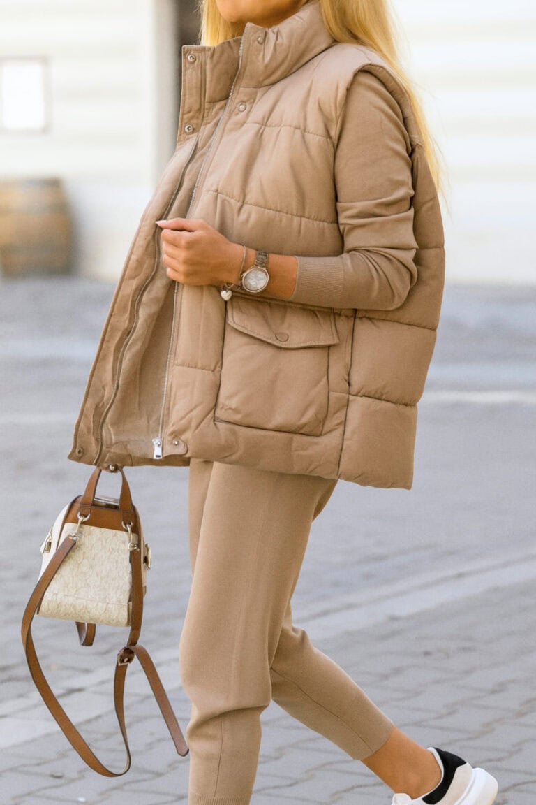 Monochrome padded vest, joggers, and fitted top for a cozy chic winter look.