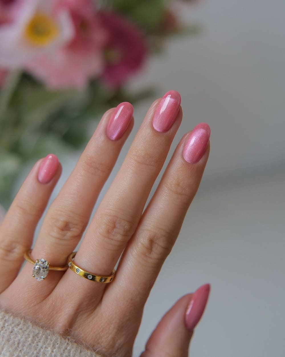 Sheer pink nails with a cat-eye effect