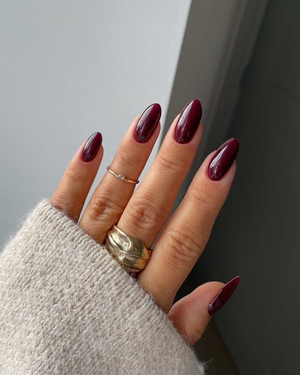 Deep burgundy nails with a classic glossy look