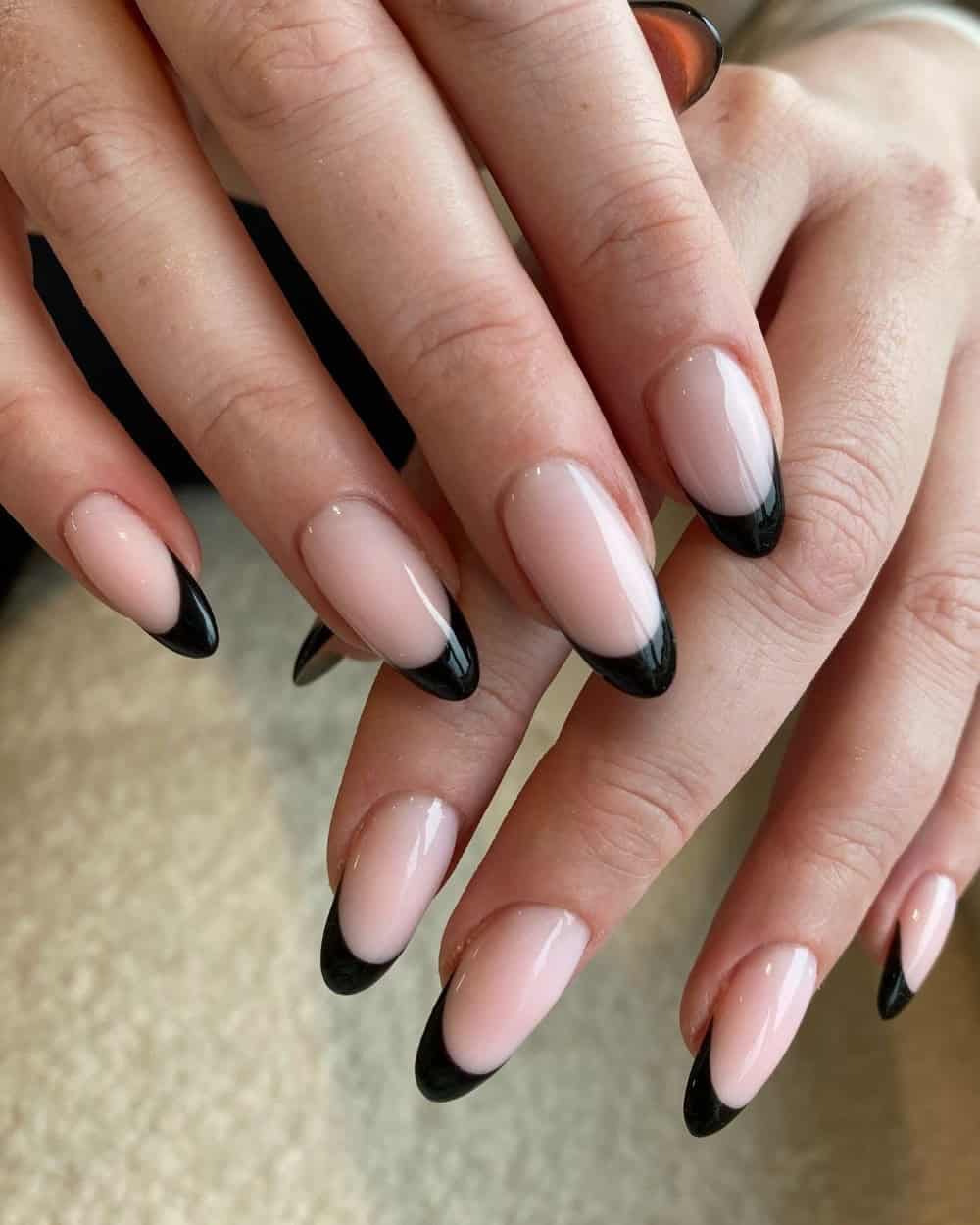 A minimalist design with a black accent nail