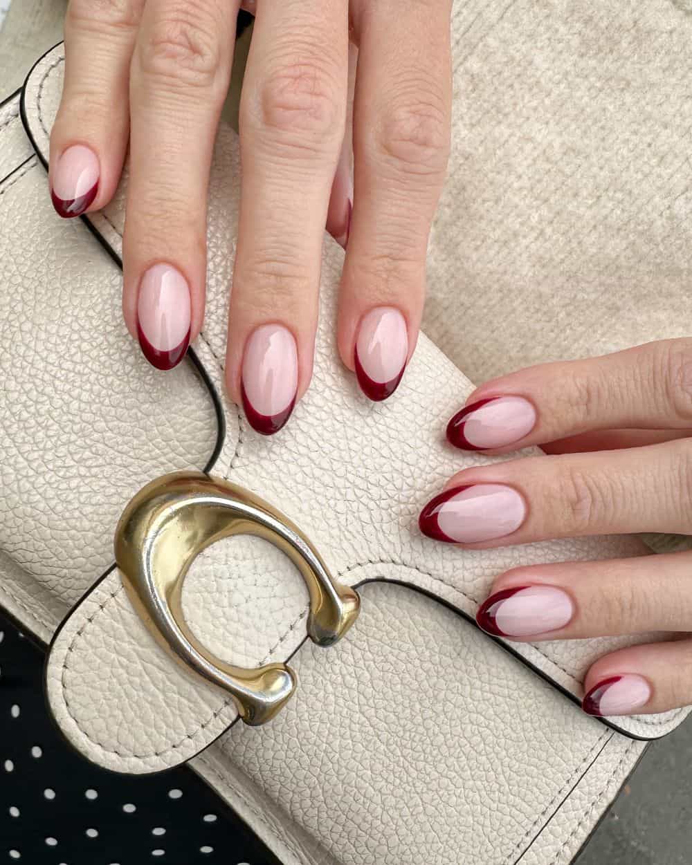 Close-up of rich red wine colored nails