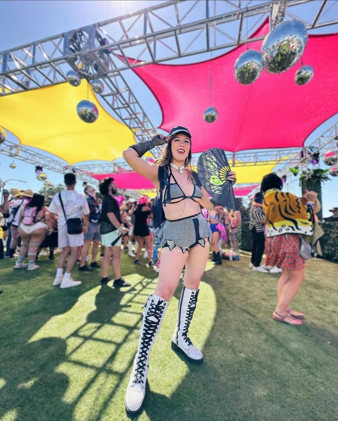 A futuristic and edgy festival outfit featuring metallic textures, bold cuts, and a fearless attitude.