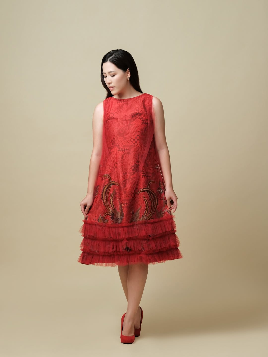 A structured dress showcasing intricate batik patterns, presenting a refined and modern interpretation of traditional art.