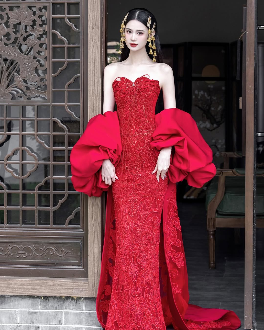 A dramatic and opulent dress inspired by couture, designed for a spectacular Chinese New Year entrance.