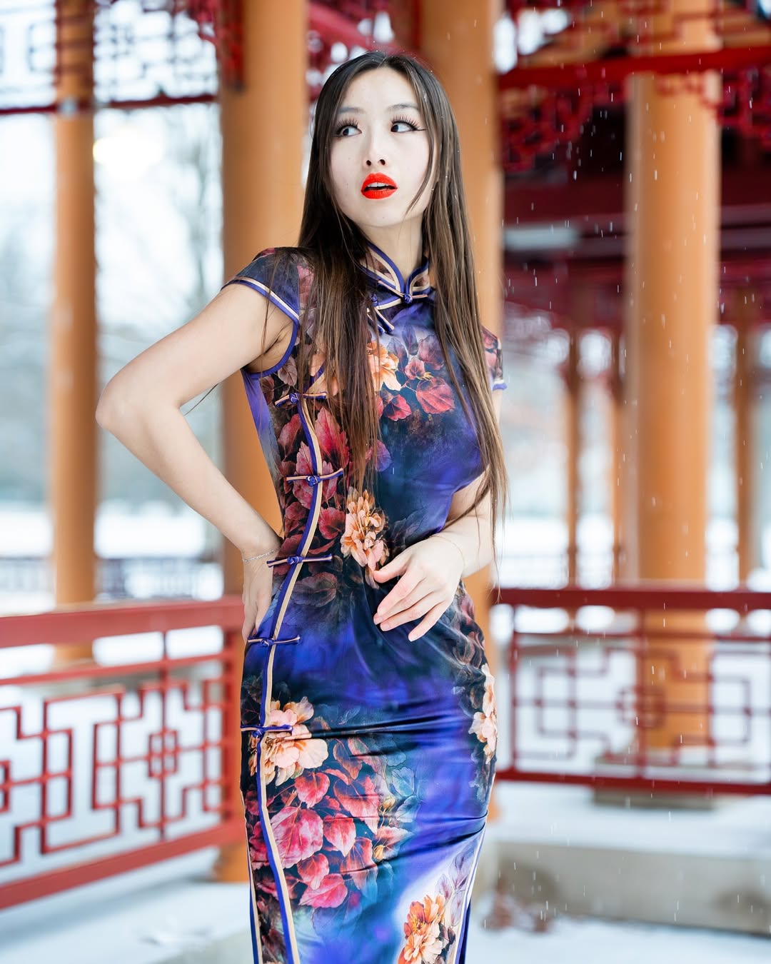 A fitted dress inspired by qipao design with bold floral patterns, offering a romantic and cinematic appeal for Lunar New Year.