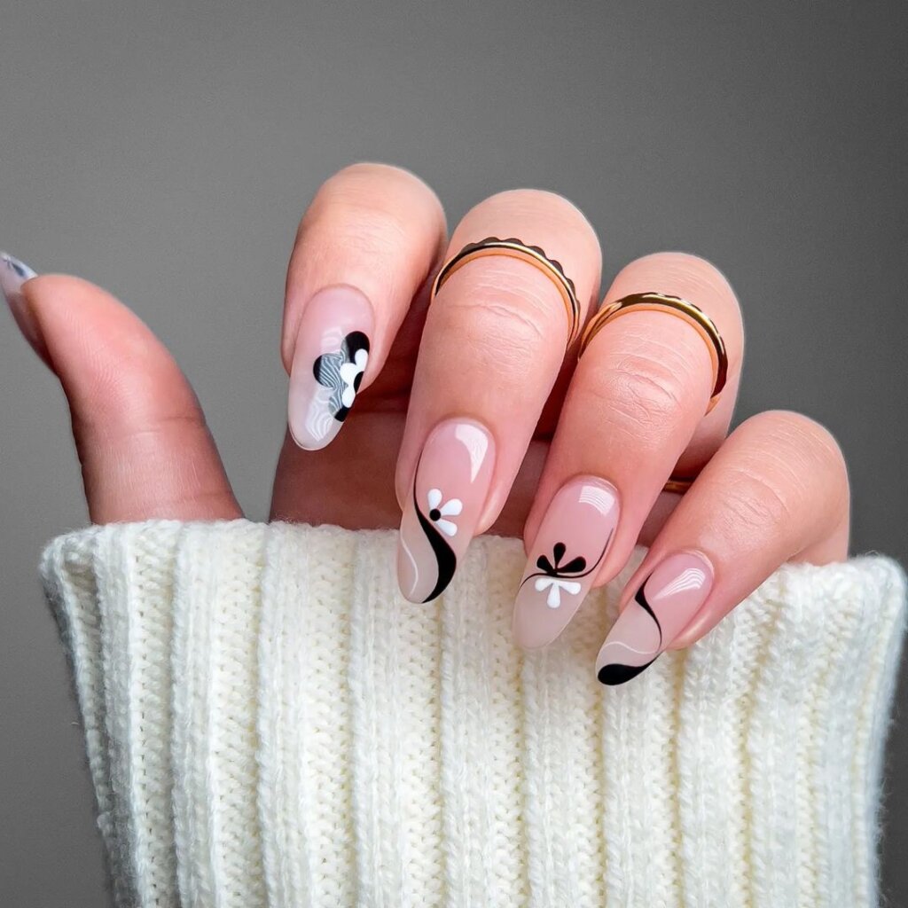 Sheer base with striking black and white floral designs.