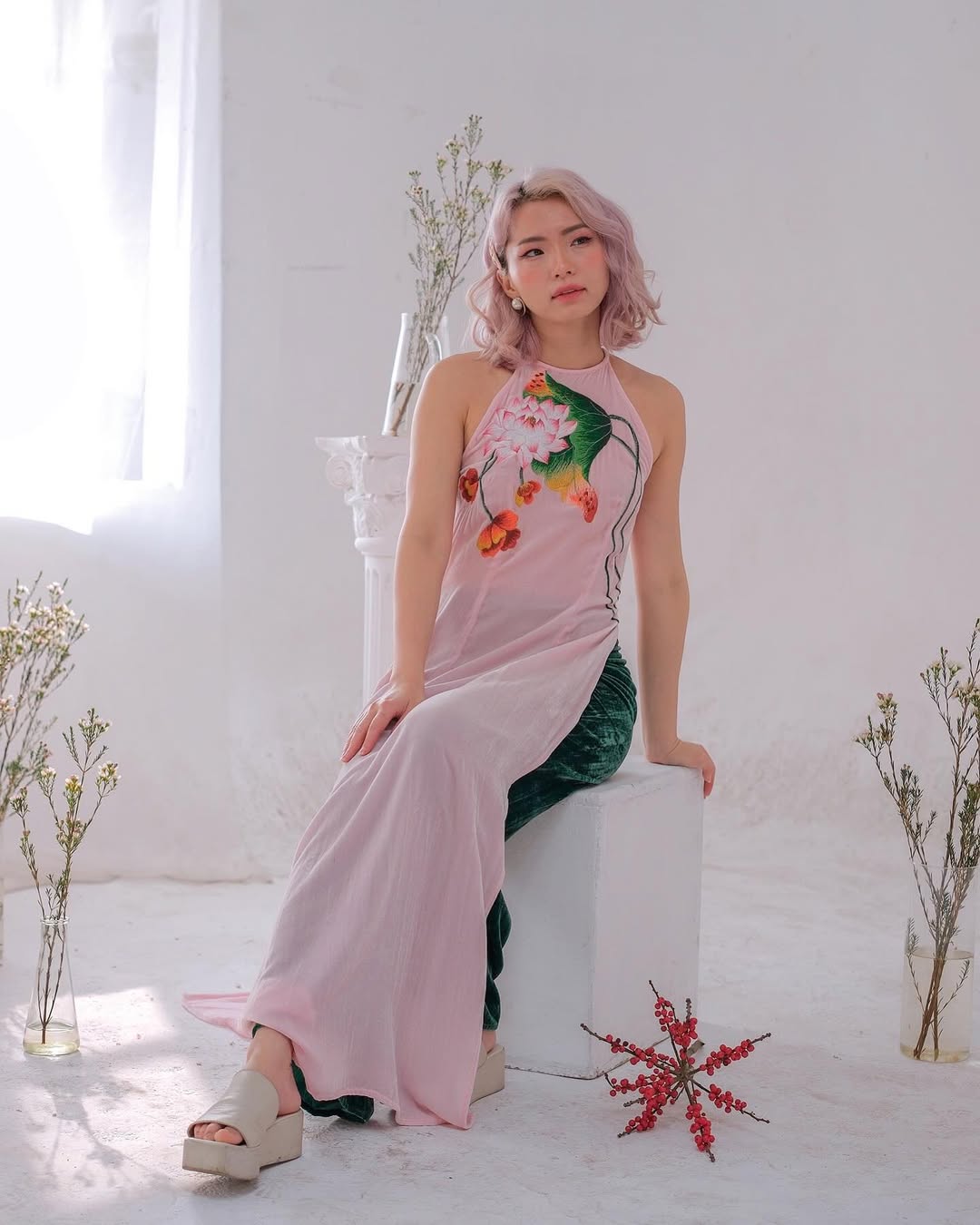 A dress in soft tones with a classic silhouette, embodying warmth, connection, and timeless respect for tradition.