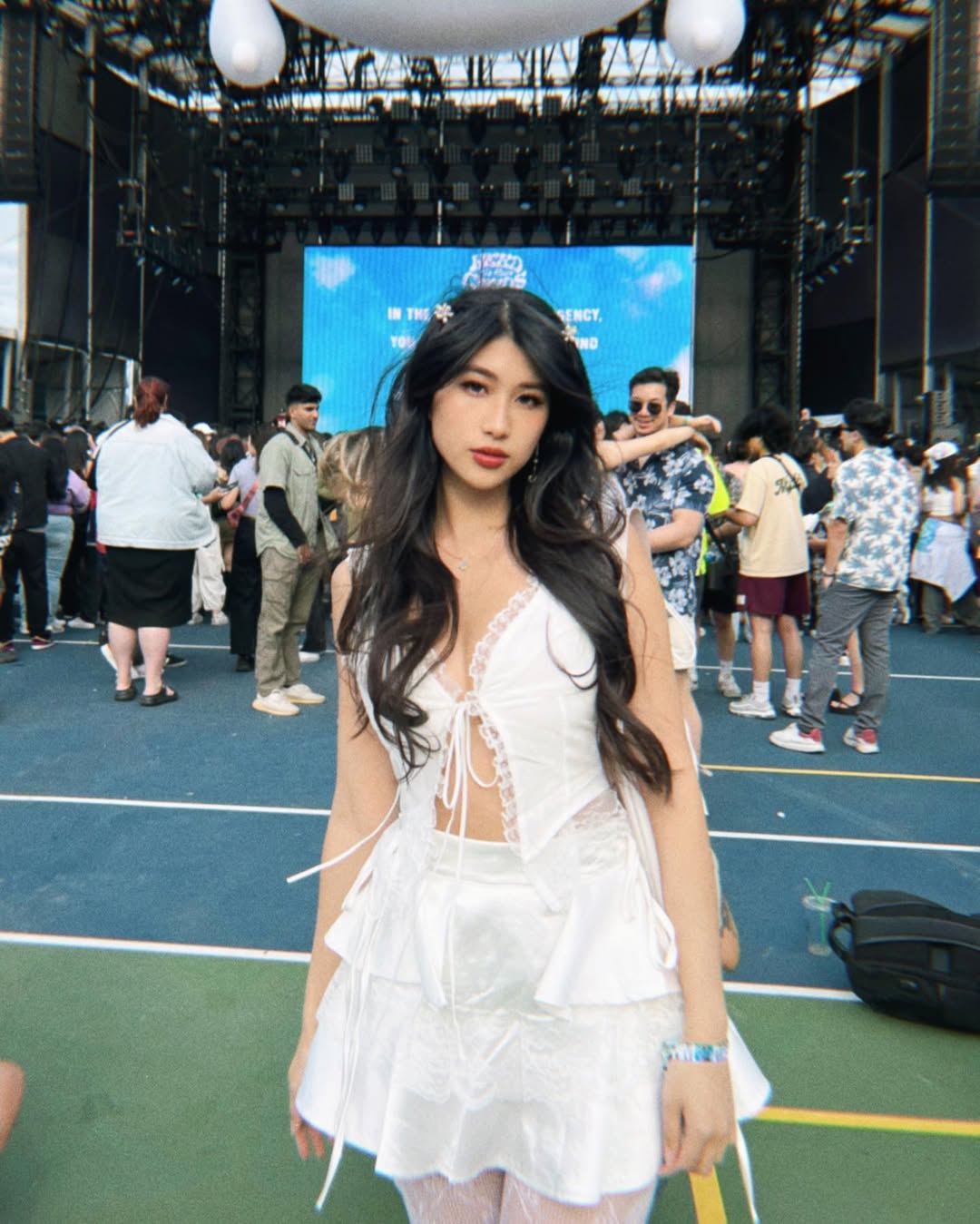 A chic and wearable festival outfit characterized by clean lines, soft fabrics, and subtle, interesting details.