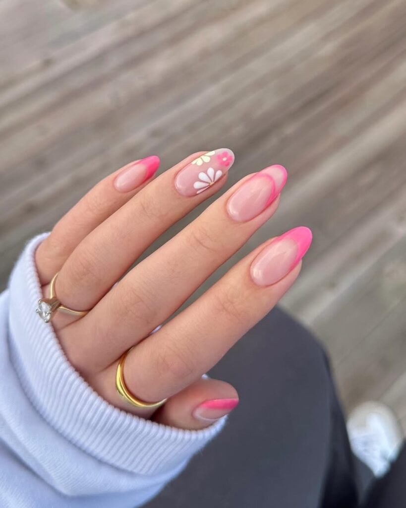 Bright pink French tips with subtle floral accents for Easter.