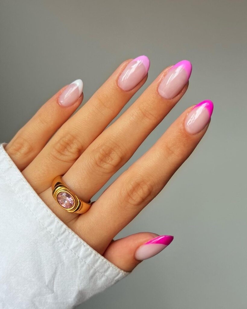 French tips with a bright pink accent on a sheer base.