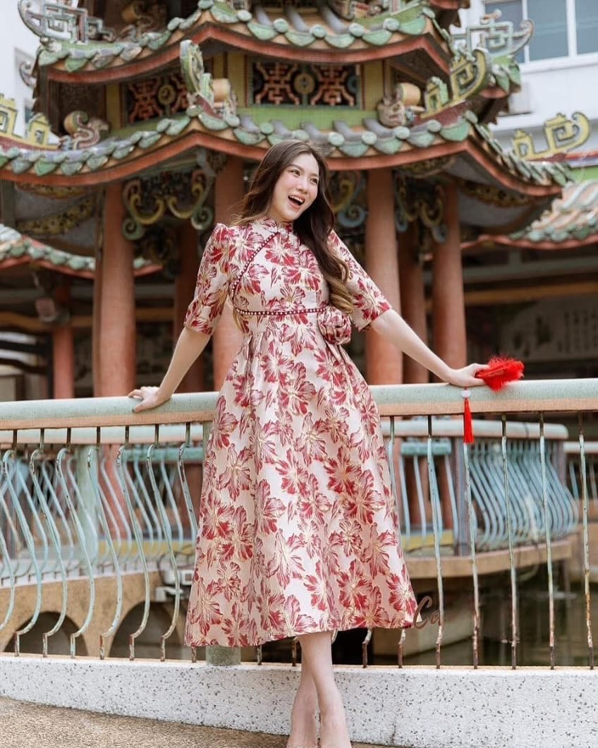 A dress featuring soft floral patterns with a gentle structure, evoking a serene, temple-like atmosphere.