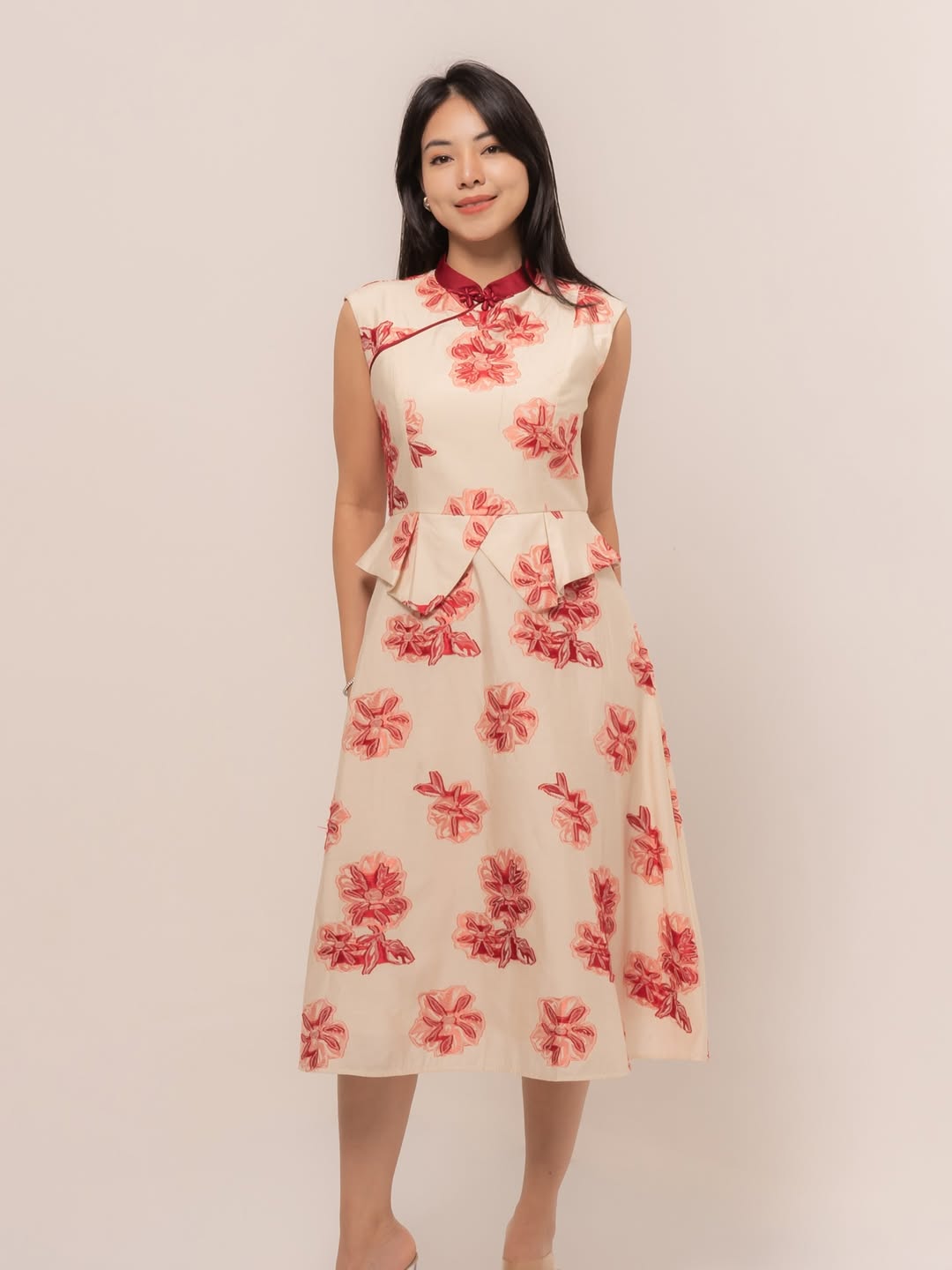 A light and airy dress in soft neutral tones with subtle floral detailing, offering a gentle festive touch.