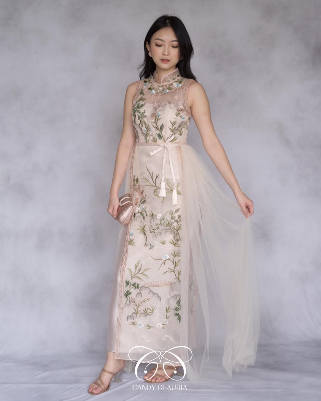 A soft, pastel-colored dress with delicate embroidery and sheer elements, exuding gentle femininity and understated elegance.