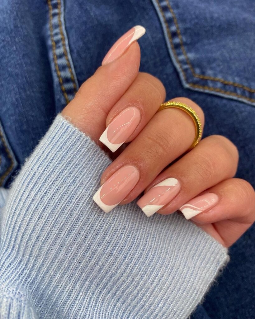 Minimalist French tips featuring clean white curved lines on a neutral base.