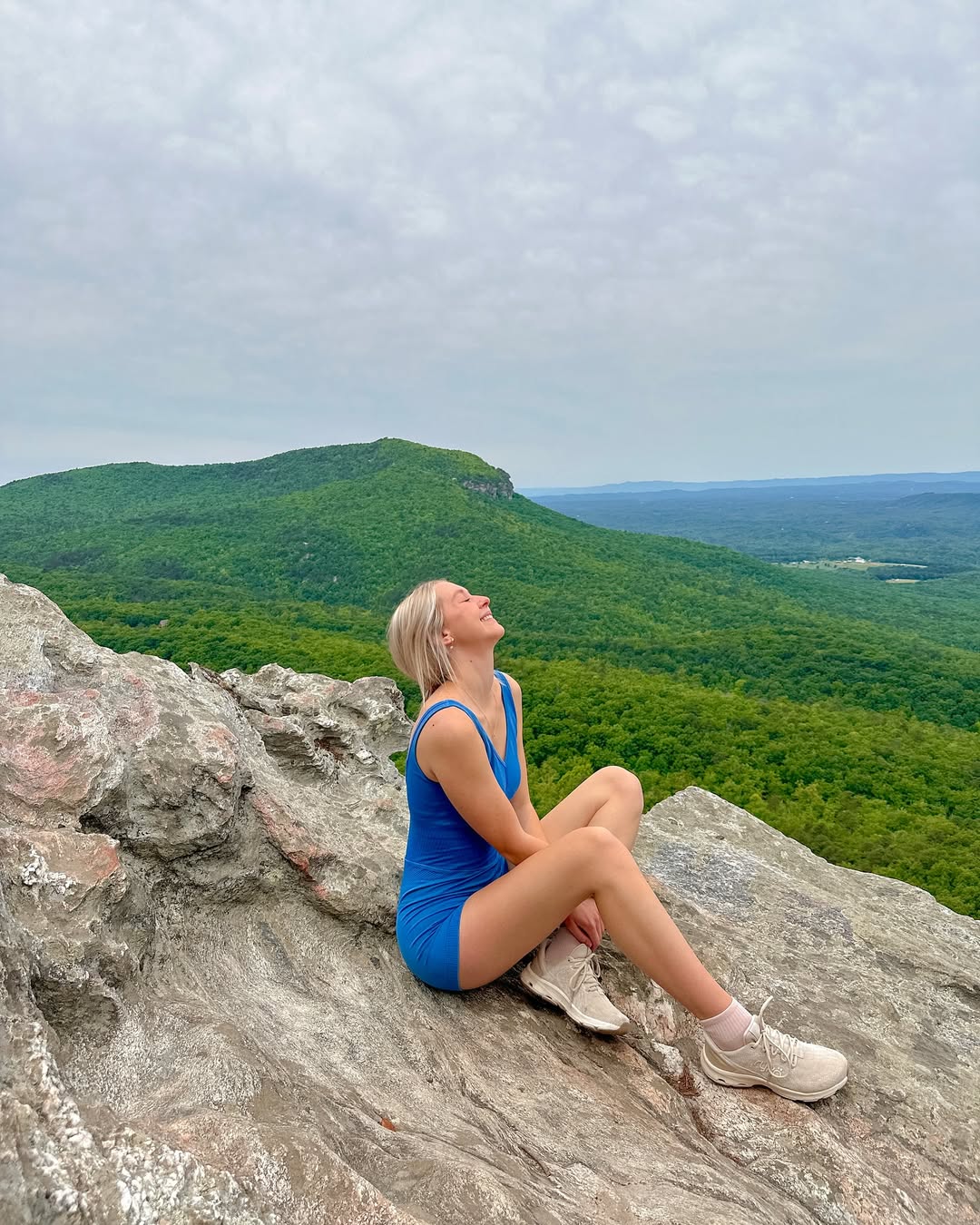 A bright blue active dress paired with sneakers, embodying a sense of freedom and confidence for outdoor spring activities.