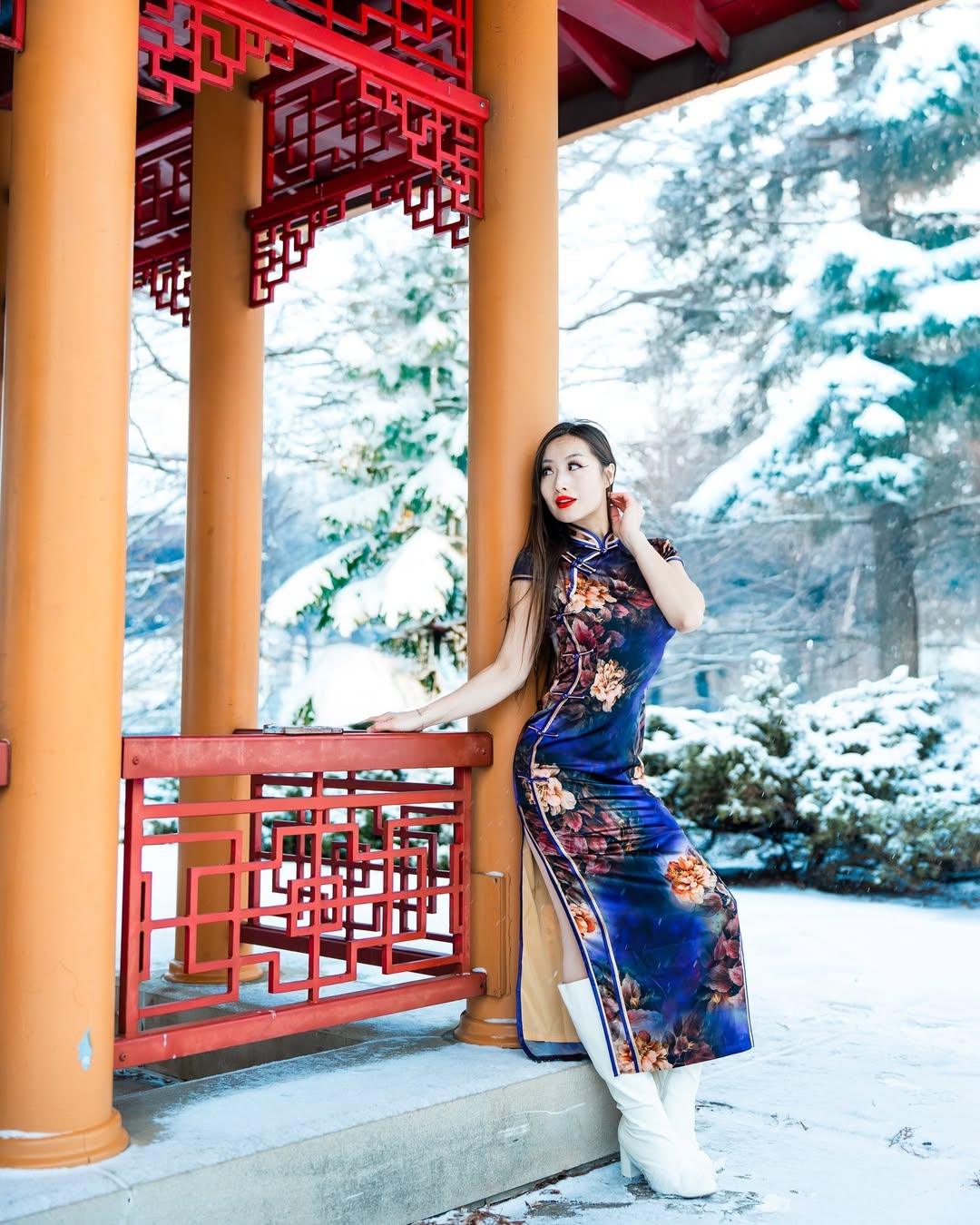 A long, flowing dress with deep floral motifs, suitable for a winter Chinese New Year celebration, evoking a fairytale atmosphere.