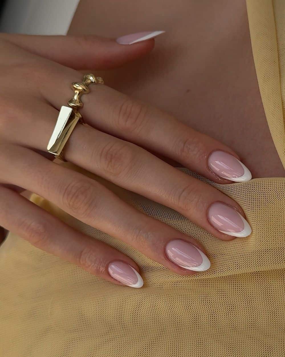 Almond shaped nails with French tips