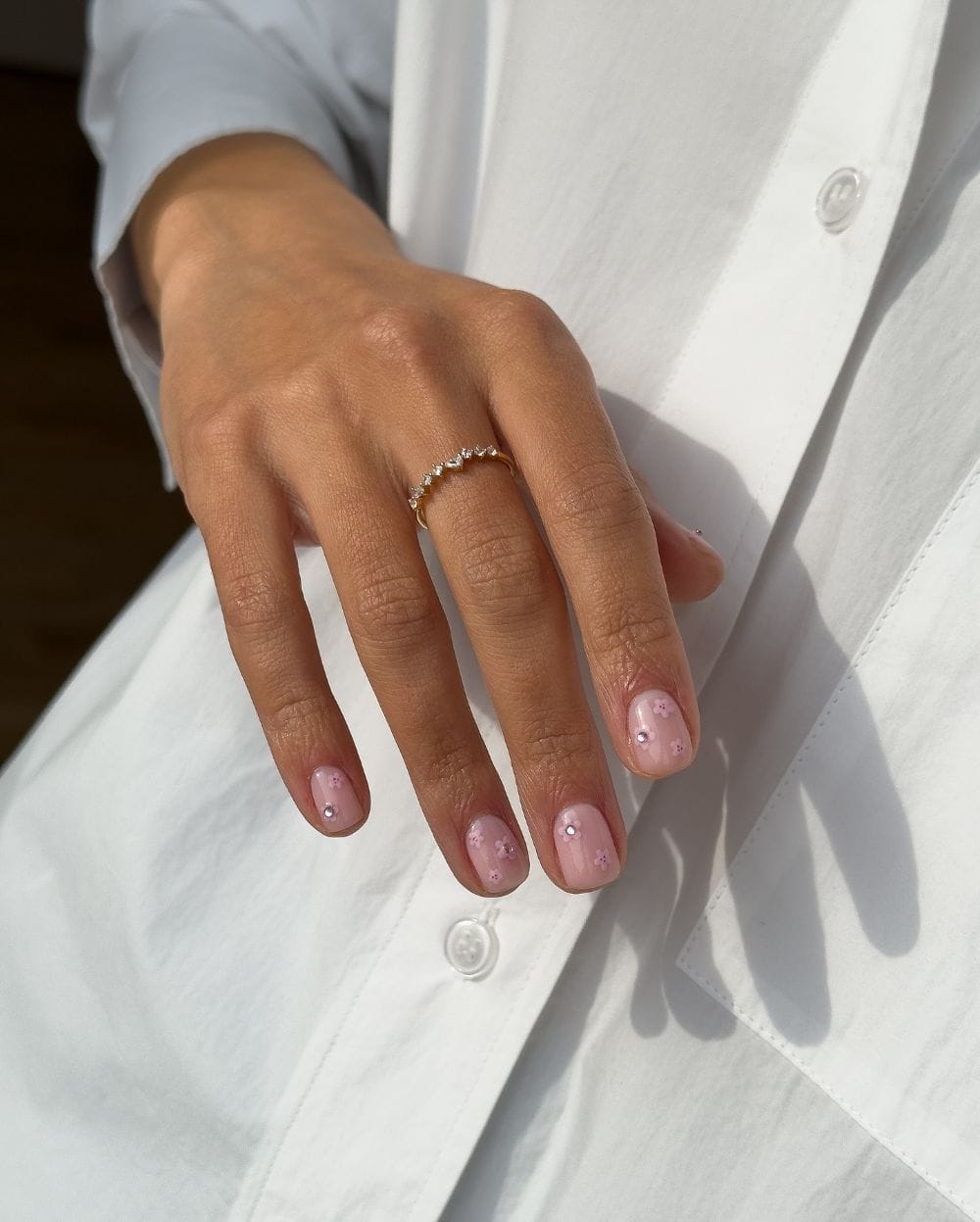 Subtle pink nails with floral art