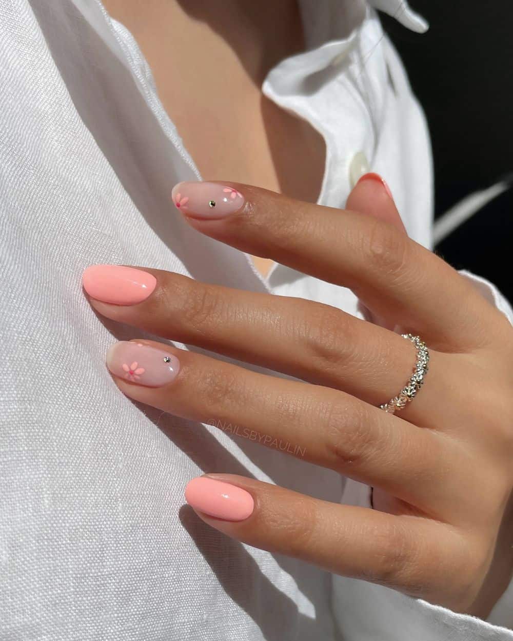 Peach nails with floral art