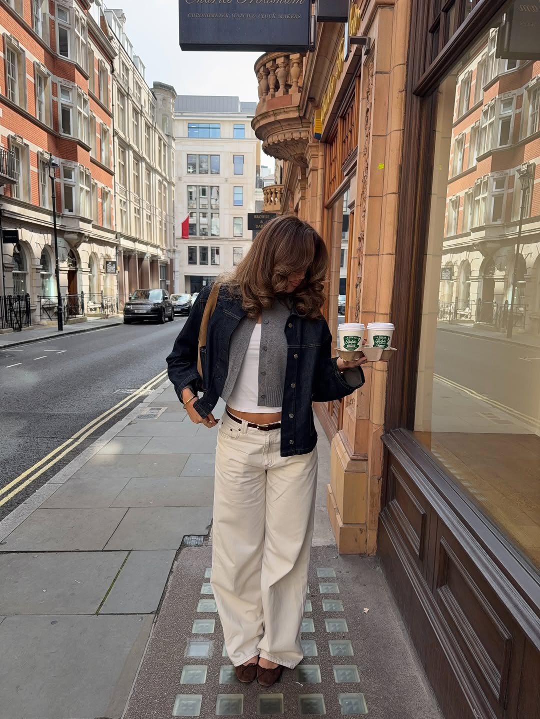 Denim jacket over cropped cardigan