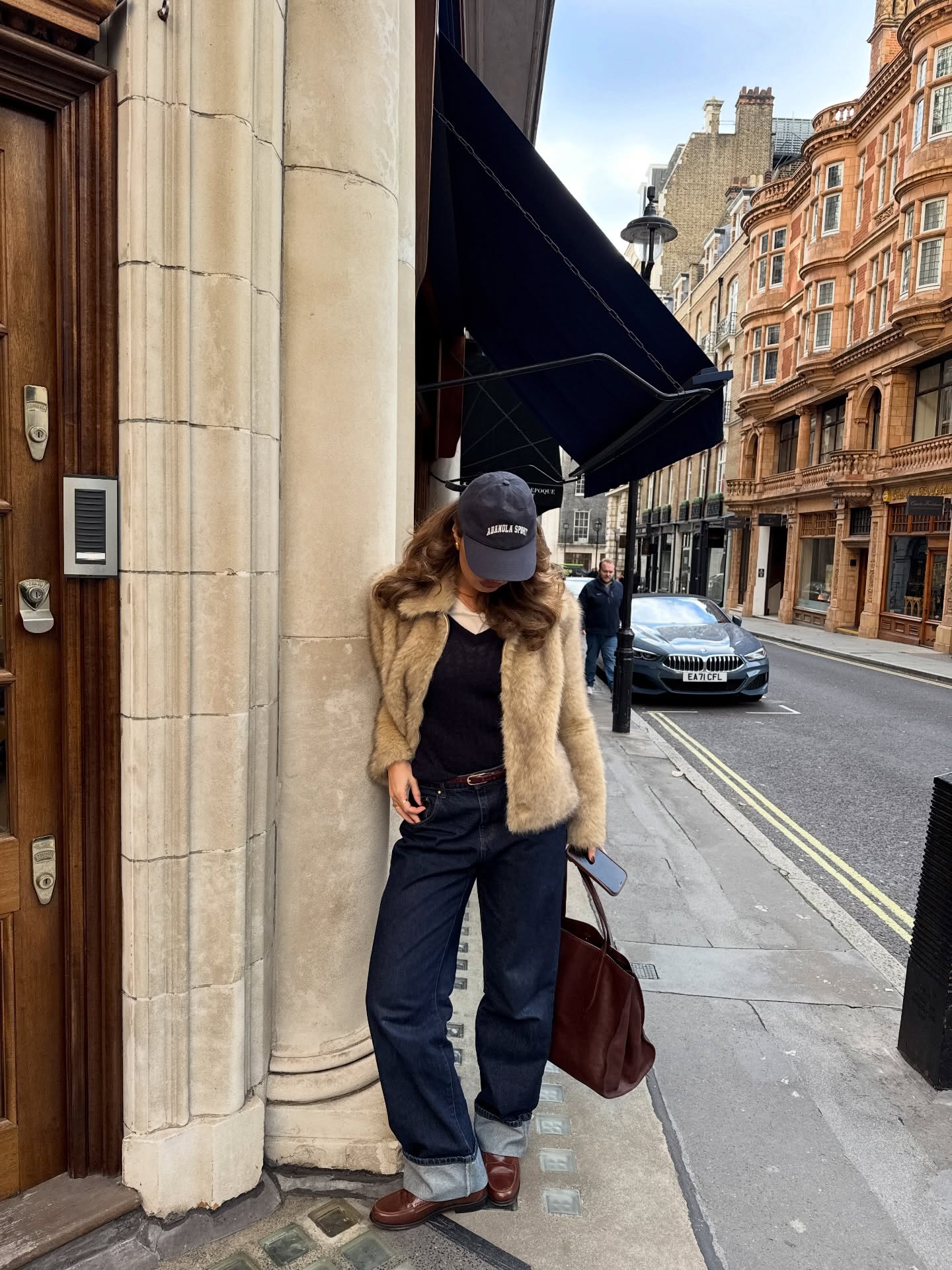 Faux fur jacket with cuffed jeans