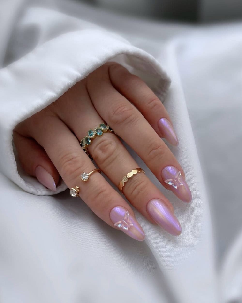 Lilac nails with butterfly charms