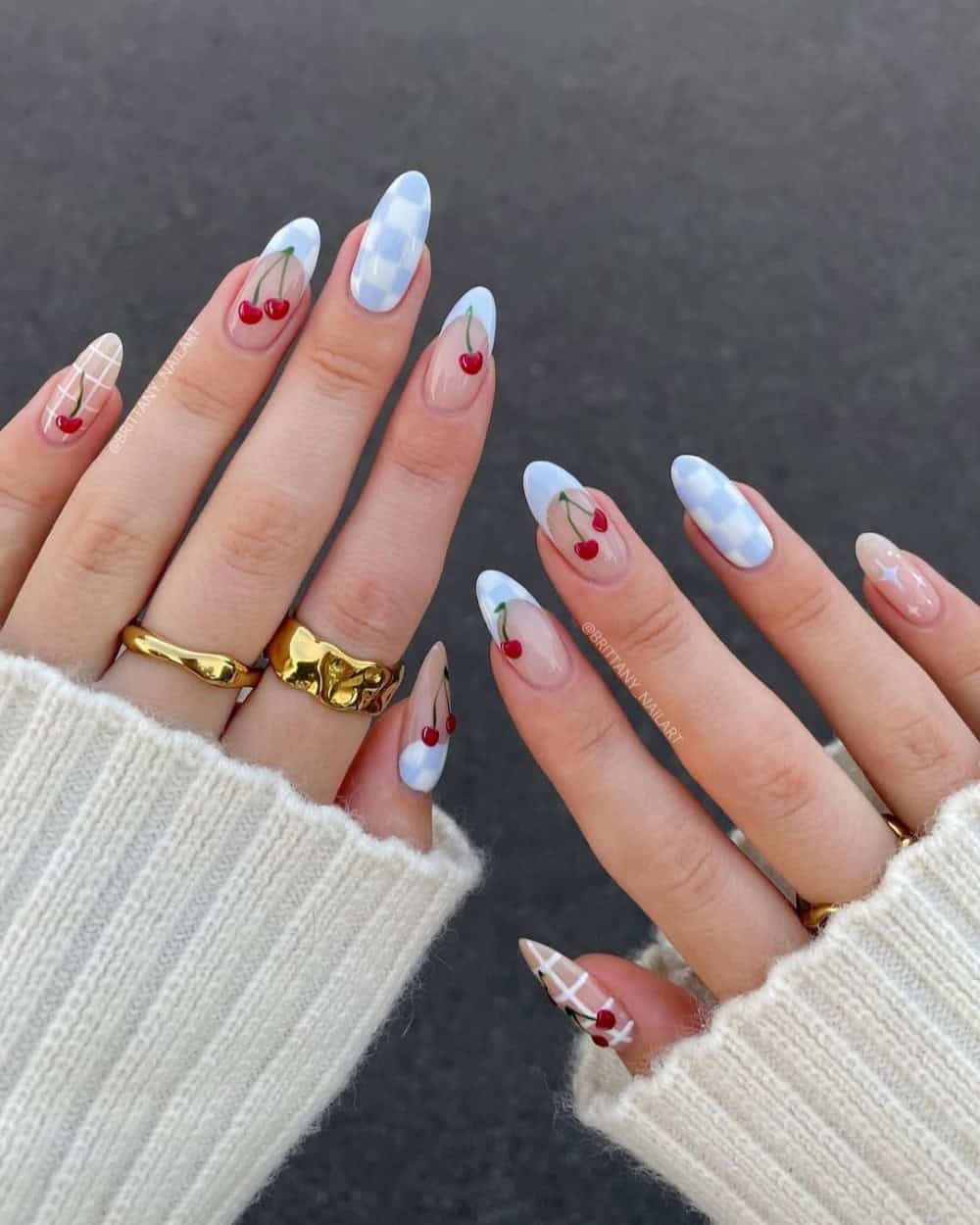 Blue and red checkerboard nails with cherry art