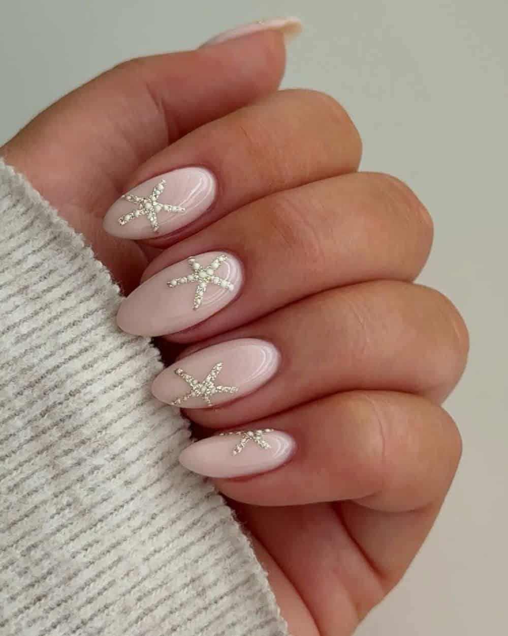 Textured ivory starfish on milky white nails