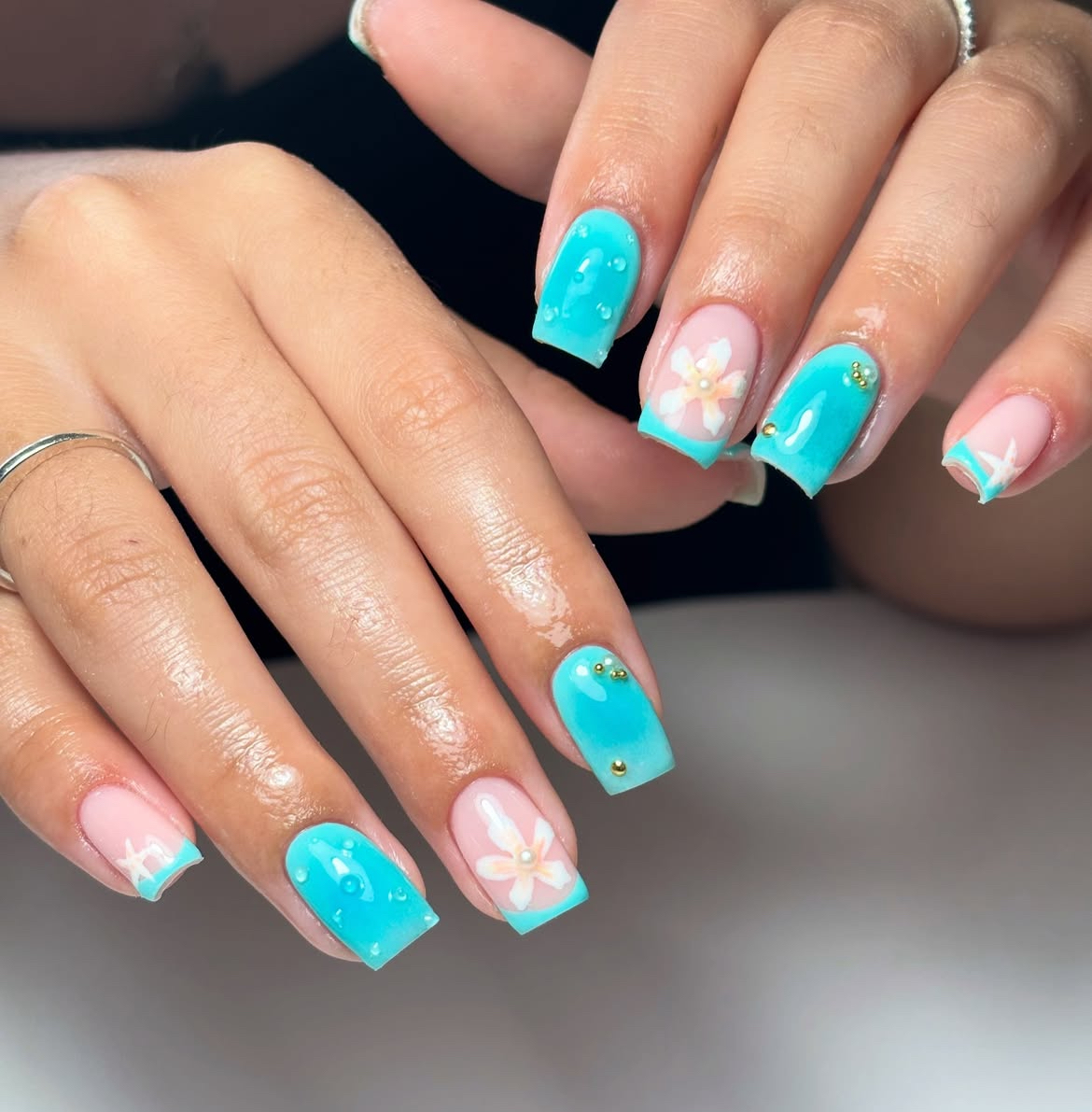 Lagoon Glow with Floral Accents Nails