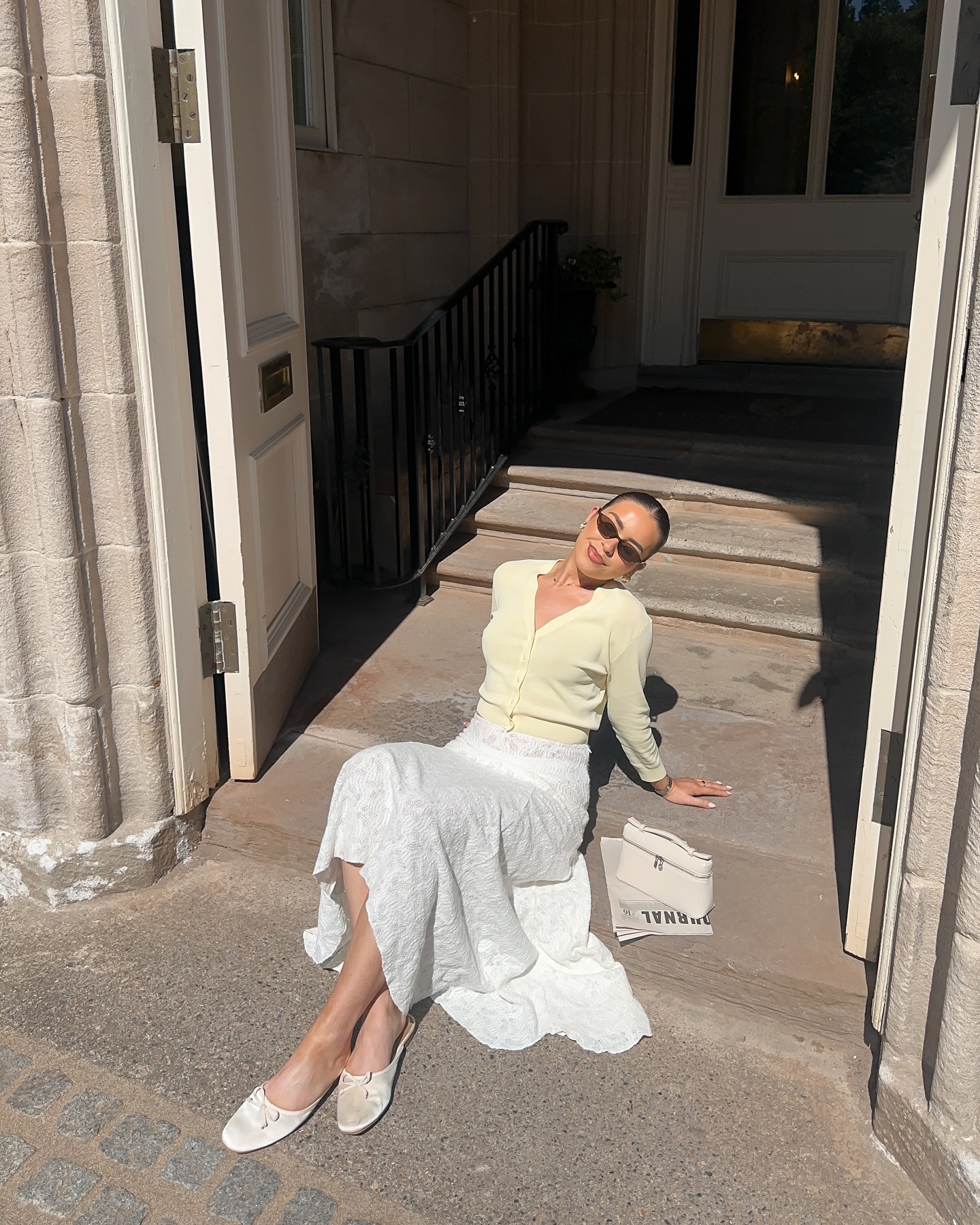 Butter yellow cardigan with a white maxi skirt outfit