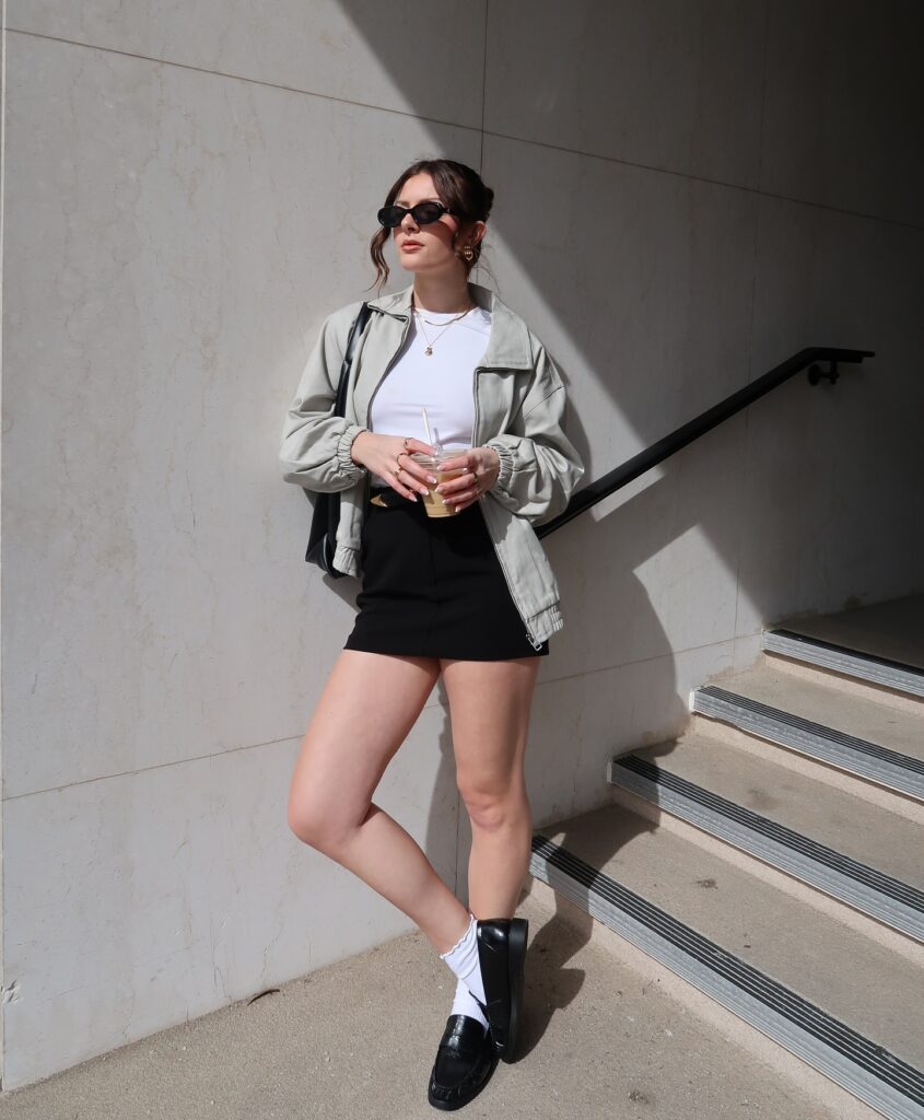 White t-shirt with a black mini skirt