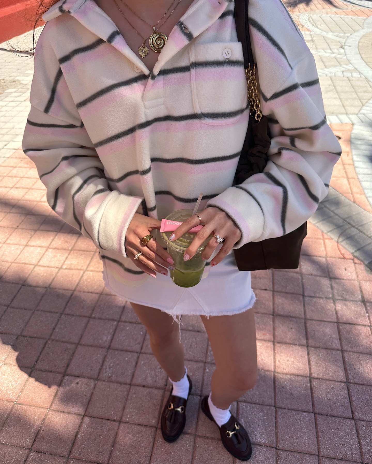 Striped pullover with a white mini skirt