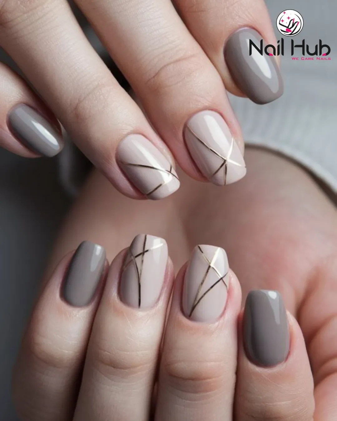 Taupe nails with fine linear accents